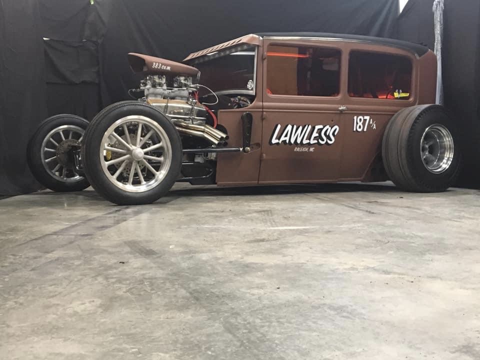 Lawless, a patina rat rod sedan with a rear drag slick