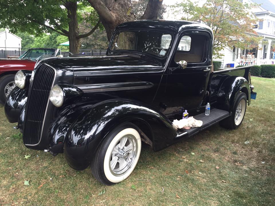 Black vintage pickup truck on whitewalls