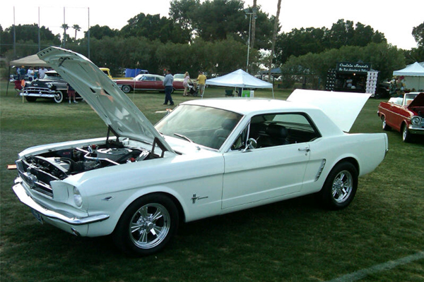 Classic white Ford Mustang at a car show