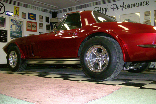 Candy red C2 Corvette on Radir wheels, garage display