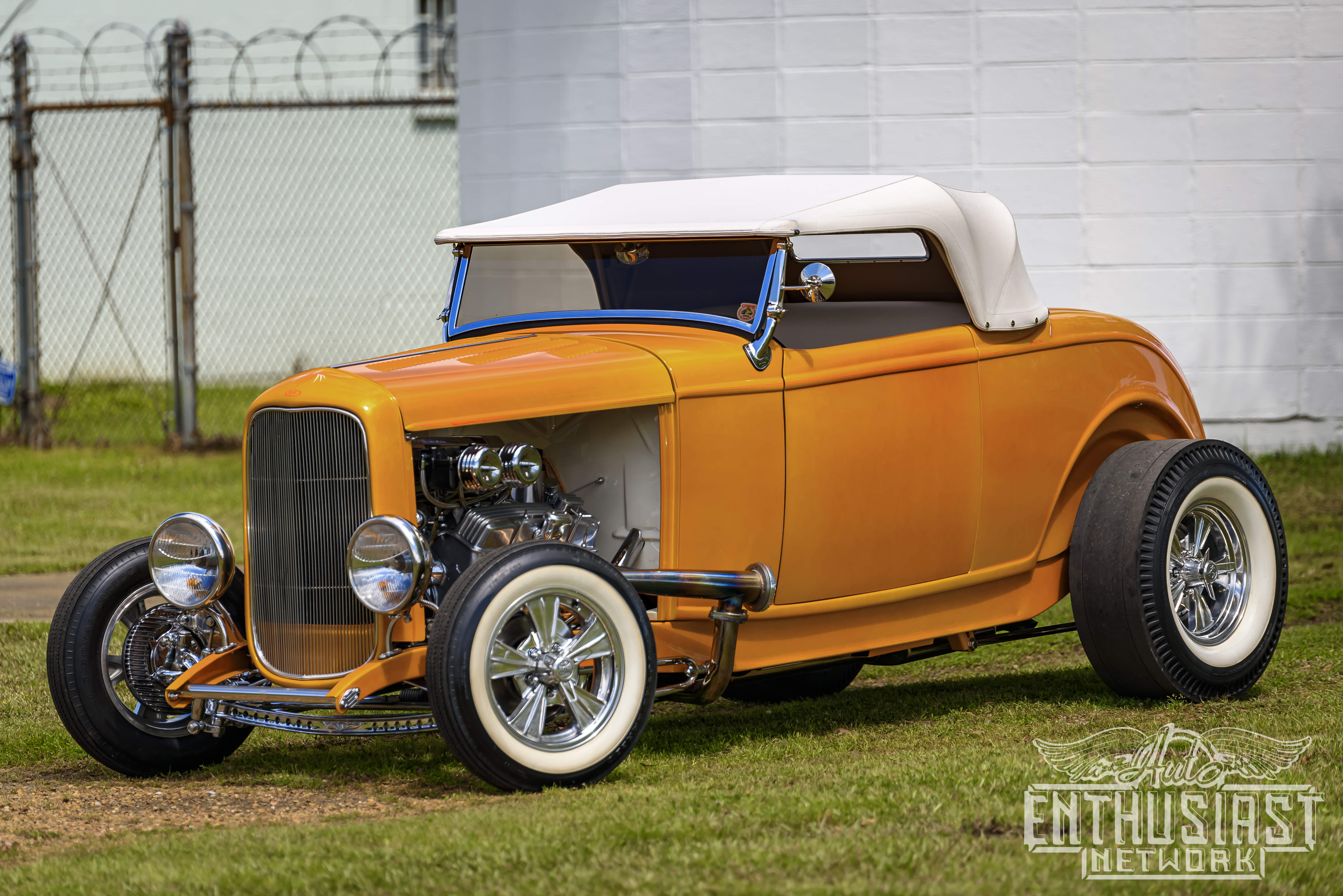 Gold 1932 Ford roadster with white convertible top on Radir whitewalls